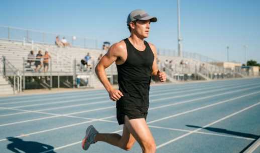 Runner wearing a breathable workout hat designed for sweat control during outdoor exercise